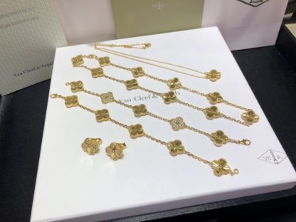 Van Cleef & Arpels Vintage Alhambra Pendant, Earrings, 5 motifs bracelet and 10 motifs necklace Yellow Gold